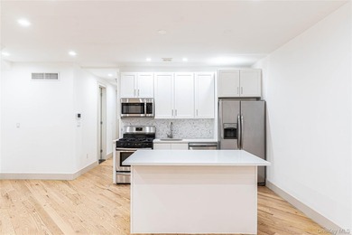 This lovely 2-family home was gut renovated in 2020 and includes - photo 5