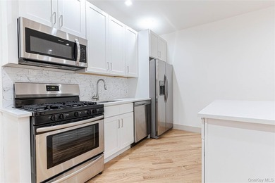 This lovely 2-family home was gut renovated in 2020 and includes - photo 7