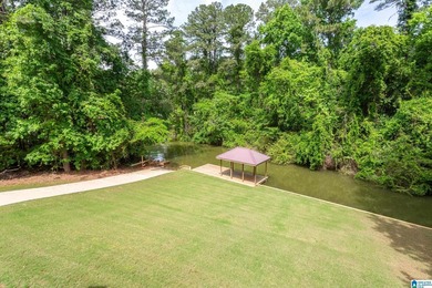 Private lake living at its finest! Tucked away on a wooded lot - photo 2