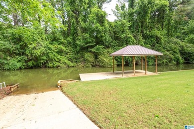 Private lake living at its finest! Tucked away on a wooded lot - photo 3