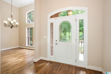 Private lake living at its finest! Tucked away on a wooded lot - photo 5