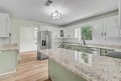 Recently renovated and move-in ready, this spacious 4-bedroom, 2 - photo 8