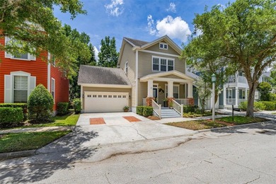 Located in Celebration, this 3-bedroom, 2.5-bathroom home backs - photo 1