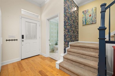 Located in Celebration, this 3-bedroom, 2.5-bathroom home backs - photo 8