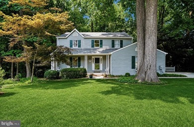 Tucked away on a quiet, wooded homesite, this beautiful 4BR/3 - photo 1