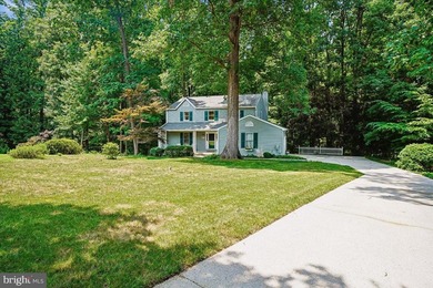 Tucked away on a quiet, wooded homesite, this beautiful 4BR/3 - photo 2