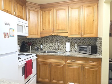 Well-maintained 1-bedroom, 1.5-bath residence featuring granite - photo 13