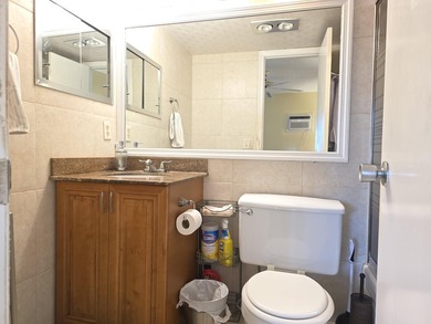 Well-maintained 1-bedroom, 1.5-bath residence featuring granite - photo 24