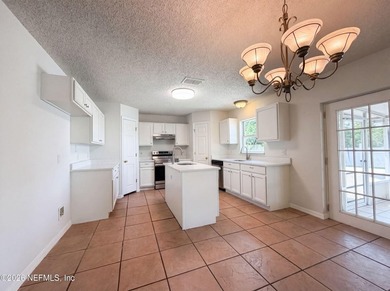 2158 Willesdon Dr W is a two-story Jacksonville home with a - photo 2