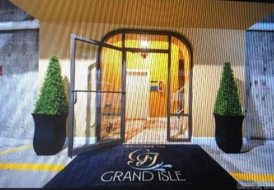 Highly desired Grand Isle Condominium fabulously designed! This