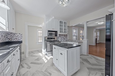 Renovated and offering the rare luxury of both first- and - photo 3