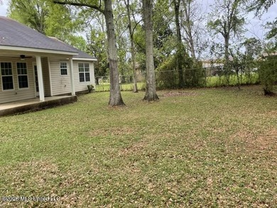 This property features 3 bedrooms and 2 bathrooms. Covered back - photo 11