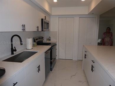 Welcome to this beautifully renovated first-floor condo in the - photo 3