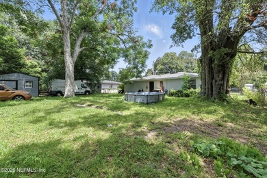 HUGE PRICE IMPROVEMENT on this 4-bedroom, 2-bath home is full of - photo 19