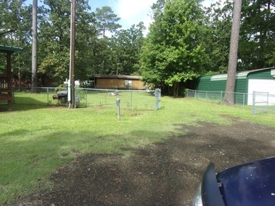 Attractive, log type home sitting on three lots, fenced,  with