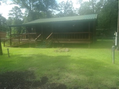 Attractive, log type home sitting on three lots, fenced,  with