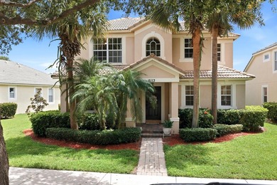 Welcome to a beautifully maintained residence in the highly - photo 1