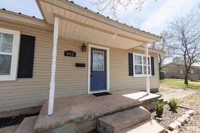 Cute cottage style home with large fenced yard and shop. Garage