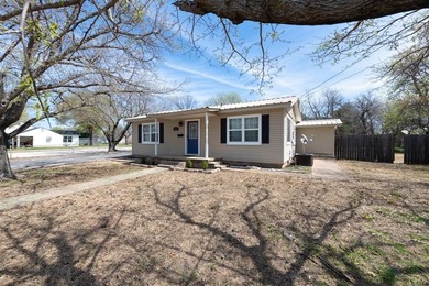 Cute cottage style home with large fenced yard and shop. Garage