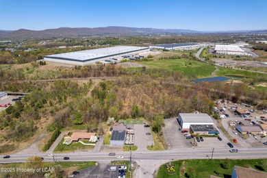 This 5,100 SQ. FT. building sits on a two-acre lot just outside