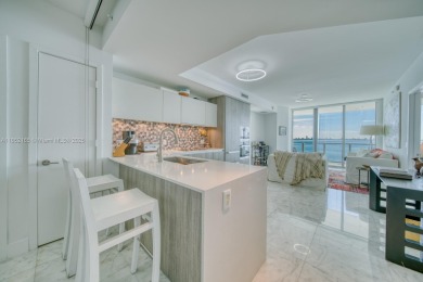 Experience breathtaking Biscayne Bay views from this 2 bed + den