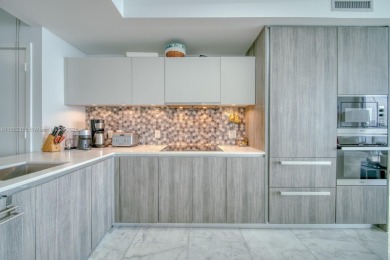 Experience breathtaking Biscayne Bay views from this 2 bed + den