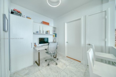 Experience breathtaking Biscayne Bay views from this 2 bed + den