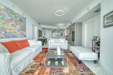 Experience breathtaking Biscayne Bay views from this 2 bed + den