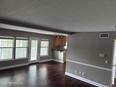 This 950-square-foot, two-bedroom, two-bath end unit sits in the - photo 2