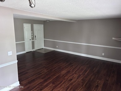 This 950-square-foot, two-bedroom, two-bath end unit sits in the - photo 3