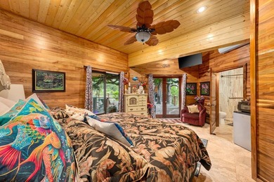 Set on 9.63 acres outside Hilo, this furnished 8-bedroom, 8-bath - photo 13