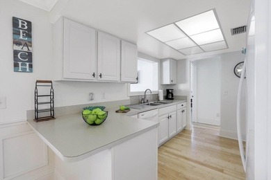 Step into this beautifully updated 3-bedroom island retreat on - photo 8