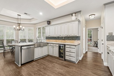 Beautifully situated on a heavily treed one-acre lot in the - photo 11