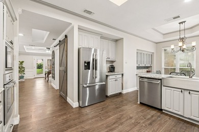 Beautifully situated on a heavily treed one-acre lot in the - photo 12
