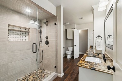 Beautifully situated on a heavily treed one-acre lot in the - photo 25
