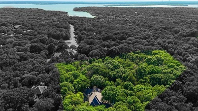 Nestled on a breathtaking 3.645-acre homesite in the highly - photo 34