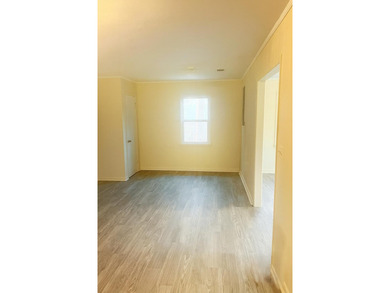 This beautifully renovated home boasts 3 spacious bedrooms and 1 - photo 3