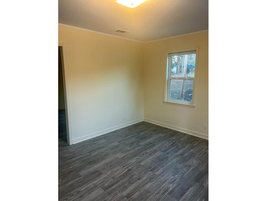 This beautifully renovated home boasts 3 spacious bedrooms and 1 - photo 4