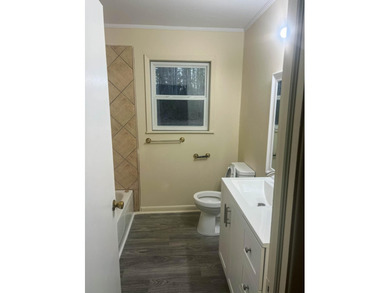 This beautifully renovated home boasts 3 spacious bedrooms and 1 - photo 6