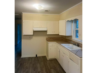 This beautifully renovated home boasts 3 spacious bedrooms and 1 - photo 8
