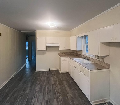 This beautifully renovated home boasts 3 spacious bedrooms and 1 - photo 9