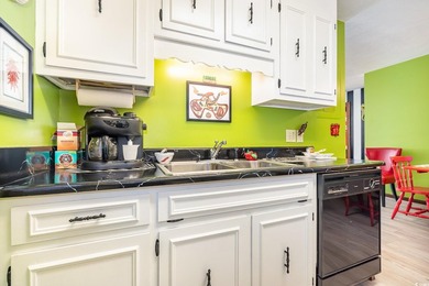 Welcome to this charming two-bedroom, two-bathroom end-unit - photo 14