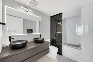 This 1-bedroom, 1.5-bath residence at Platinum Condominium