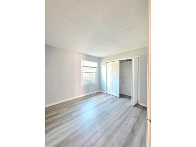 This waterfront ground-level 2-bedroom, 1-bath charmer comes - photo 11