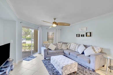 Welcome to this inviting first-floor condo in a gated community - photo 11