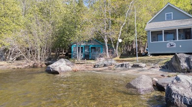 Tucked away on coveted Sebec Lake, this rustic camp feels like - photo 33