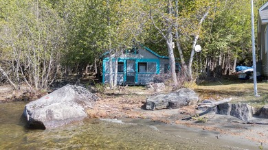 Tucked away on coveted Sebec Lake, this rustic camp feels like - photo 34