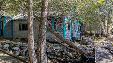 Tucked away on coveted Sebec Lake, this rustic camp feels like - photo 46