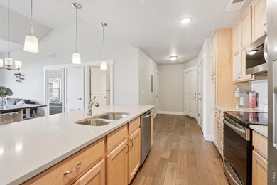 Enjoy low-maintenance living in this third-floor end-unit condo