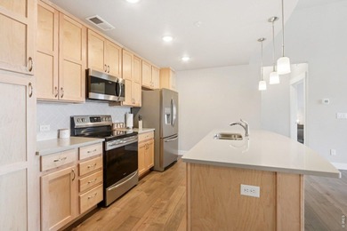 Enjoy low-maintenance living in this third-floor end-unit condo